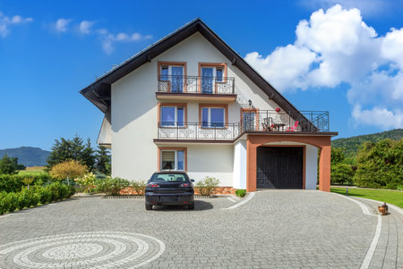 Spring mountain landscape with a family houseの写真素材