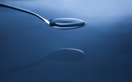 Pure water on spoonの写真素材