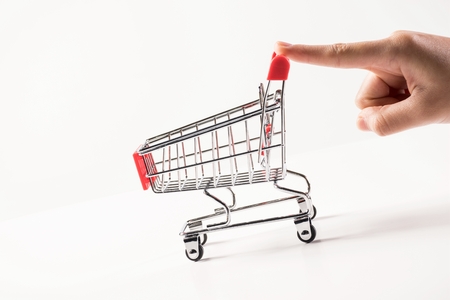 shopping discount concept with a trolley on white backgroundの写真素材