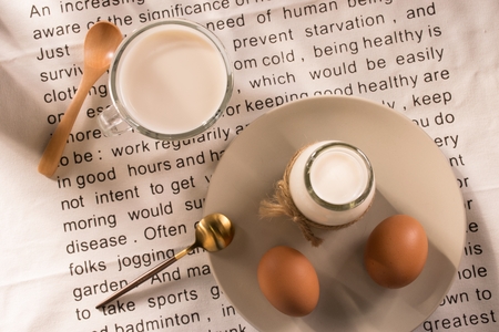 Egg and milk on the tableの写真素材