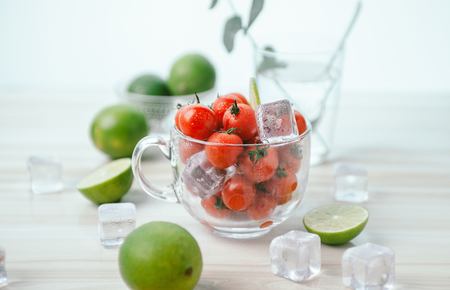 A refreshing green limes and tomatoesの写真素材