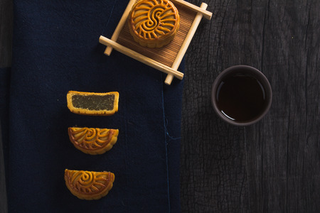 Moon cake on dark backgroundの写真素材