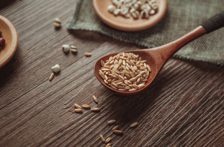 Wheat in the wooden spoon close up viewの写真素材