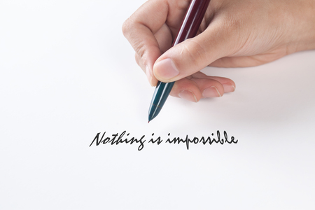Hand writing with nothing is impossibleの写真素材