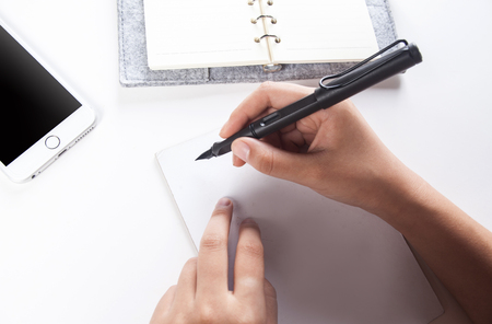 Hand writing to paperのeditorial素材