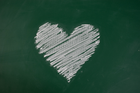 Drawing love with hand-painted chalkの写真素材
