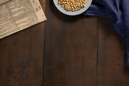 soybean with book on wooden backgroundの写真素材