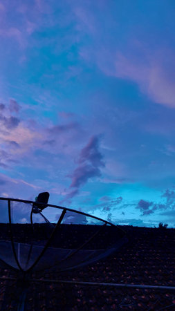 Satellite dish with beautiful sky at twilight time in the evening.の写真素材
