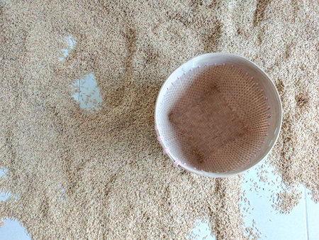 Sesame seeds in a basket on the floor, closeup of photoの写真素材