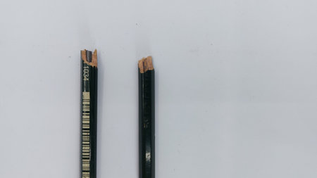 a green pencil that has been damaged because someone broke it.の写真素材