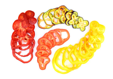 Collection of multicolored pepper slices isolated on the white background. The bell pepper, also...