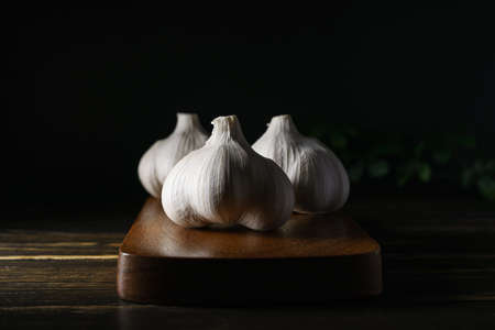 Fresh garlic on wooden backgroundの写真素材