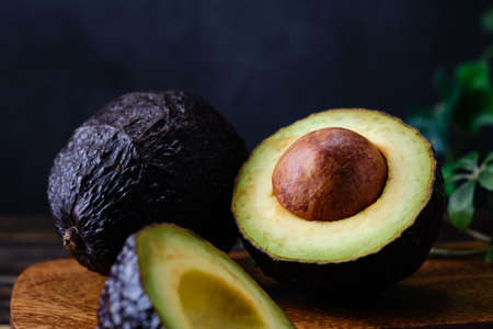 Fresh organic avocado on wooden tableの写真素材