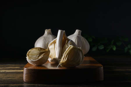Fresh garlic on wooden background