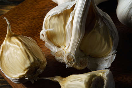 Fresh garlic on wooden background