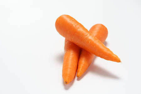 Fresh carrots on wooden table