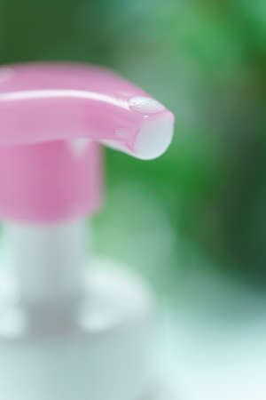 Liquid soap bottle and bubbleの写真素材
