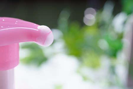 Liquid soap bottle and bubbleの写真素材