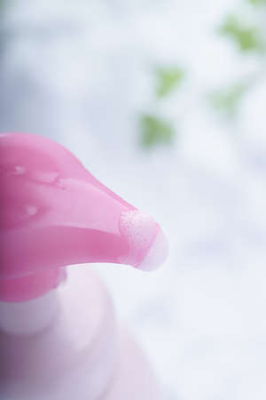 Liquid soap bottle and bubbleの写真素材