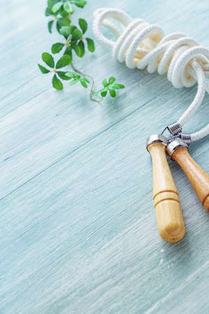 Fitness Equipment (skip/jump rope) on wooden background
