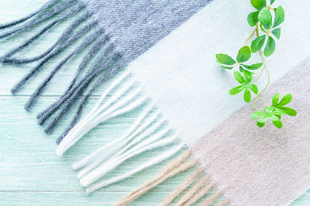 Woolen scarf on wooden backgroundの写真素材