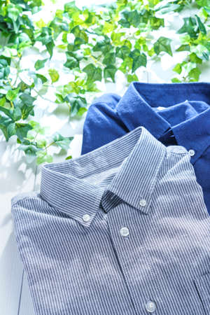 Men's casual shirt on wooden tableの写真素材