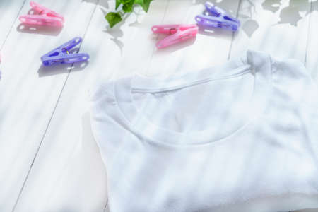 Men's T-shirt on wooden tableの写真素材