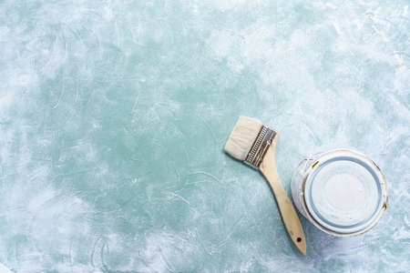 Paint and brush placed on a wooden boardの写真素材