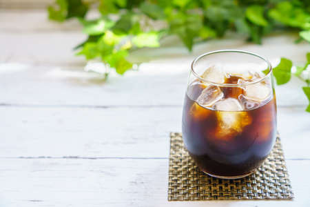 Iced coffee on wooden table