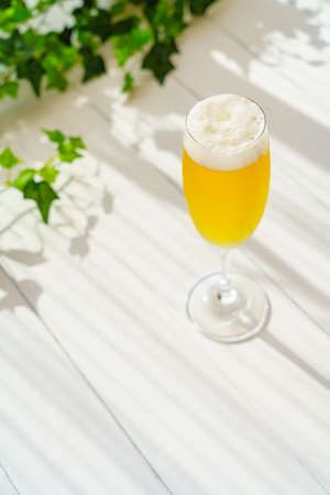 Glass of beer on wooden tableの写真素材