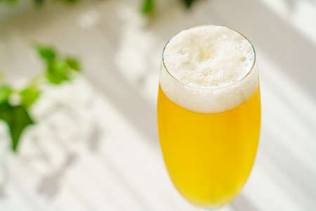 Glass of beer on wooden table