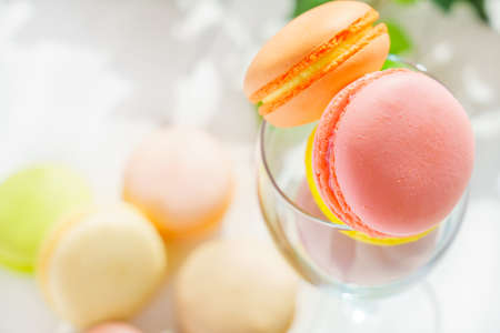 Sweet colorful macaroons on wooden backgroundの写真素材