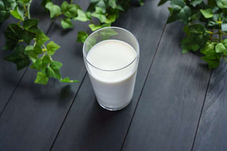 Cold milk in glass cupの写真素材