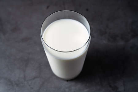 Cold milk in glass cupの写真素材
