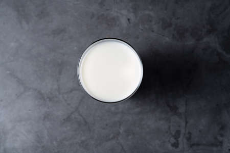 Cold milk in glass cupの写真素材
