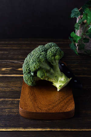 Broccoli isolated on wooden table