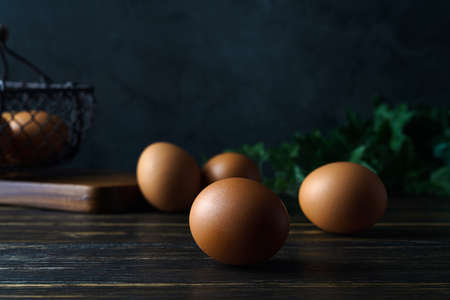 Fresh eggs on wooden table