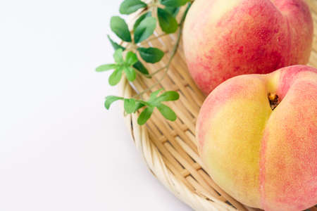 Fresh peaches on wooden tableの写真素材