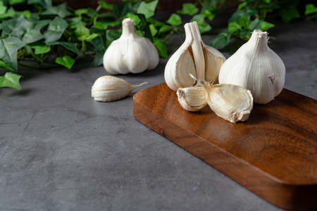 Fresh garlic on wooden tableの写真素材