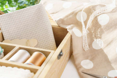 Sewing accessories on wooden table