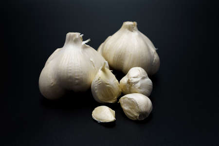 Fresh garlic on wooden tableの写真素材