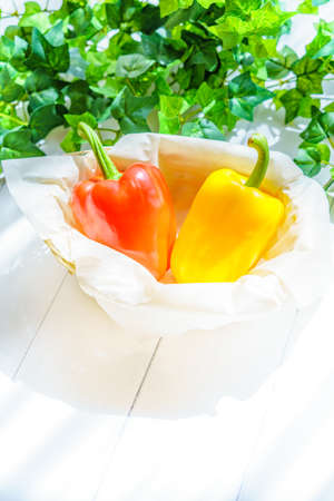 colorful paprika on wooden tableの写真素材