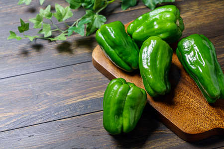 Raw green organic bell peppersの写真素材