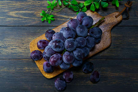 Fresh grapes on wooden table