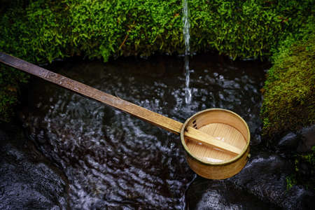 Wash hands and rinse mouth at a 'chozusha'