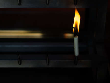 Closeup of candle flame in Japanese temple