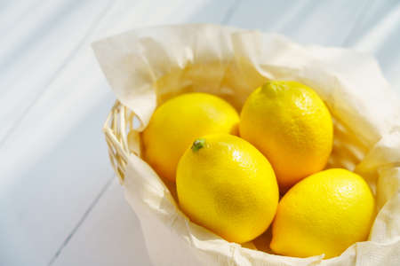 Fresh lemon fruit isolated on wooden tableの写真素材