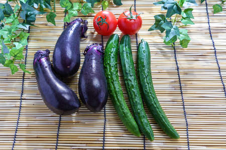 Fresh eggplant, cucumber and tomatesの写真素材