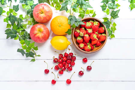 Vegetables and fruits on wooden tableの写真素材