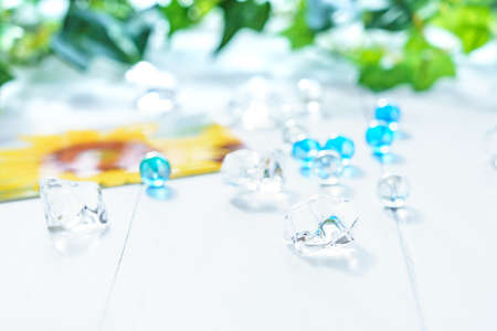 Summer scene with marbles on wooden tableの写真素材